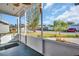 Bright screened porch overlooks the front yard at 1415 Yale Dr, Holiday, FL 34691