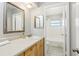 Neutral bathroom featuring wood cabinets, countertops, an ornate mirror, and a shower/tub combo at 14160 82Nd Ter, Seminole, FL 33776