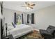 Bedroom featuring a window, neutral walls, and a colorful accent rug at 14160 82Nd Ter, Seminole, FL 33776