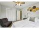 Bedroom featuring a window, chair, neutral walls, closet, and ceiling fan at 14160 82Nd Ter, Seminole, FL 33776