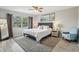 Main bedroom featuring a queen bed, nightstands, and a view of the window at 14160 82Nd Ter, Seminole, FL 33776