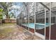 Enclosed pool area in backyard with mature trees and surrounding fence at 14160 82Nd Ter, Seminole, FL 33776