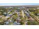 An aerial shot of a residential neighborhood with various houses and a pond at 14915 Gentilly Pl, Tampa, FL 33624