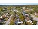 Aerial image showing a suburban neighborhood with houses and green spaces at 14915 Gentilly Pl, Tampa, FL 33624