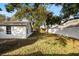 Spacious backyard with mature trees and a privacy fence at 14915 Gentilly Pl, Tampa, FL 33624