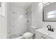 Modern bathroom with marble-look shower and white vanity at 14915 Gentilly Pl, Tampa, FL 33624