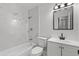 Renovated bathroom, bathtub shower combo at 14915 Gentilly Pl, Tampa, FL 33624