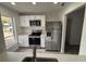 Modern kitchen, stainless steel appliances and white cabinets at 14915 Gentilly Pl, Tampa, FL 33624