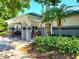 Community clubhouse featuring covered seating area and well-maintained landscaping at 30923 Burleigh Dr, Wesley Chapel, FL 33543