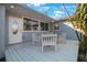 White wooden deck with seating area, adjacent to house at 920 Hull S St, Gulfport, FL 33707