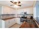 Modern white kitchen with stainless steel appliances and wood countertops at 920 Hull S St, Gulfport, FL 33707