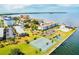 Aerial view of community, tennis courts and waterfront at 5 Gateshead Dr # 203, Dunedin, FL 34698