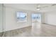 Bright bedroom with water views and wood-look floors at 5 Gateshead Dr # 203, Dunedin, FL 34698