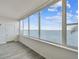 Sunroom boasts expansive water views and wood-look floors at 5 Gateshead Dr # 203, Dunedin, FL 34698