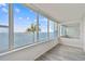 Sunroom with stunning water views and wood-look floors at 5 Gateshead Dr # 203, Dunedin, FL 34698