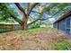 Large backyard with mature oak tree and storage shed at 106 S Nimbus Ave, Clearwater, FL 33765