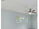 Bright bedroom with ceiling fan and large window offering natural light at 106 S Nimbus Ave, Clearwater, FL 33765