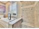 Beautiful bathroom showcasing a tub, a glass shower, and tile flooring at 12006 Stone Crossing Circle, Tampa, FL 33635