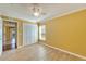 Bedroom with laminate floors, closet, and window at 12006 Stone Crossing Circle, Tampa, FL 33635