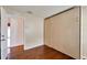 Bedroom with a murphy bed with storage, wood floor, and closet at 12006 Stone Crossing Circle, Tampa, FL 33635