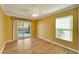 Bright bedroom with wood flooring, ceiling fan, and sliding door to the pool at 12006 Stone Crossing Circle, Tampa, FL 33635