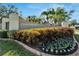 Welcoming entrance to Fountainlake community, with lush landscaping and palm trees under a clear, sunny sky at 12006 Stone Crossing Circle, Tampa, FL 33635