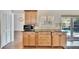 Kitchen cabinet details with microwave, granite countertop, and plantation shutters at 12006 Stone Crossing Circle, Tampa, FL 33635