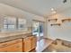 Bright kitchen featuring wooden cabinets, granite countertops, tile backsplash, and a pool view at 12006 Stone Crossing Circle, Tampa, FL 33635