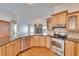 Bright kitchen with granite counters, stainless steel appliances, and a view of the living area at 12006 Stone Crossing Circle, Tampa, FL 33635