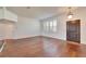 Bright living room with hardwood floors, plantation shutters, and ample natural light at 12006 Stone Crossing Circle, Tampa, FL 33635