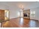 Open living room with hardwood floors, stone fireplace, and ample natural light at 12006 Stone Crossing Circle, Tampa, FL 33635