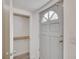 Entryway features a grey door with decorative glass and a coat closet at 5028 School Rd, Land O Lakes, FL 34638