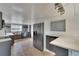 Modern kitchen with stainless steel appliances, quartz countertops, gray cabinetry, and stylish backsplash at 5028 School Rd, Land O Lakes, FL 34638