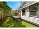 Side yard with deck and tropical landscaping at 554 6Th N Ave, St Petersburg, FL 33701