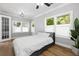 Light and airy bedroom with wood floors and large windows at 554 6Th N Ave, St Petersburg, FL 33701