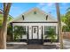 Charming light green house with dark gray accents at 554 6Th N Ave, St Petersburg, FL 33701