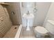 Updated bathroom with pedestal sink and shower at 8814 Bay Pointe Dr # 204, Tampa, FL 33615