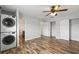 Bedroom with wood-look floors, in-unit laundry, and ample closet space at 8814 Bay Pointe Dr # 204, Tampa, FL 33615