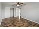 Spacious bedroom with wood-look floors and mirrored closet doors at 8814 Bay Pointe Dr # 204, Tampa, FL 33615