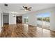 Bright living room with hardwood floors and water views at 8814 Bay Pointe Dr # 204, Tampa, FL 33615