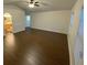 Spacious bedroom with hardwood floors and ceiling fan at 10930 Banyan Wood Way, Riverview, FL 33579