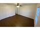 Spacious bedroom with wood-look flooring and double doors to closet at 10930 Banyan Wood Way, Riverview, FL 33579