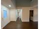 Bright entryway with hardwood floors and coat closet at 10930 Banyan Wood Way, Riverview, FL 33579