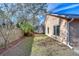 Landscaped backyard with wooden fence and palm trees at 2529 Clareside Dr, Valrico, FL 33596