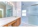 Bathroom with double sinks, wood cabinets and shower at 2529 Clareside Dr, Valrico, FL 33596