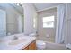 Clean bathroom with shower/tub combo, vanity, and window at 2529 Clareside Dr, Valrico, FL 33596