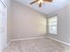 Spacious bedroom featuring carpet, ceiling fan and window at 2529 Clareside Dr, Valrico, FL 33596