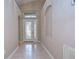 Bright entryway with tiled floor and stained-glass door at 2529 Clareside Dr, Valrico, FL 33596