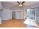 Sunlit living room with wood floors and access to backyard at 2529 Clareside Dr, Valrico, FL 33596