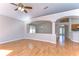 Open living room with wood flooring and views to kitchen and entry at 2529 Clareside Dr, Valrico, FL 33596